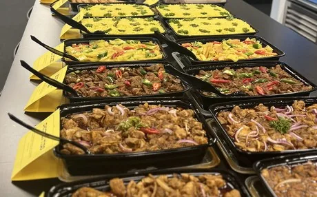 Makina Eritrean-Ethiopian catering for an office lunch: yellow rice, cabbage, beef tibs and chicken