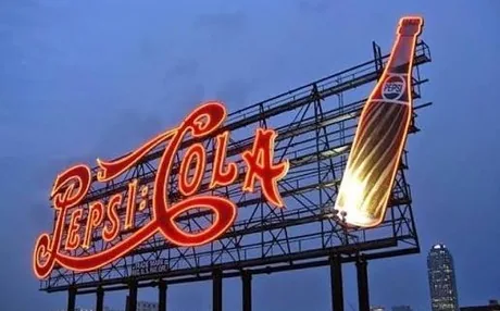 The Pepsi-Cola sign at dusk in Long Island City, Queens, home of Makina’s LIC kitchen
